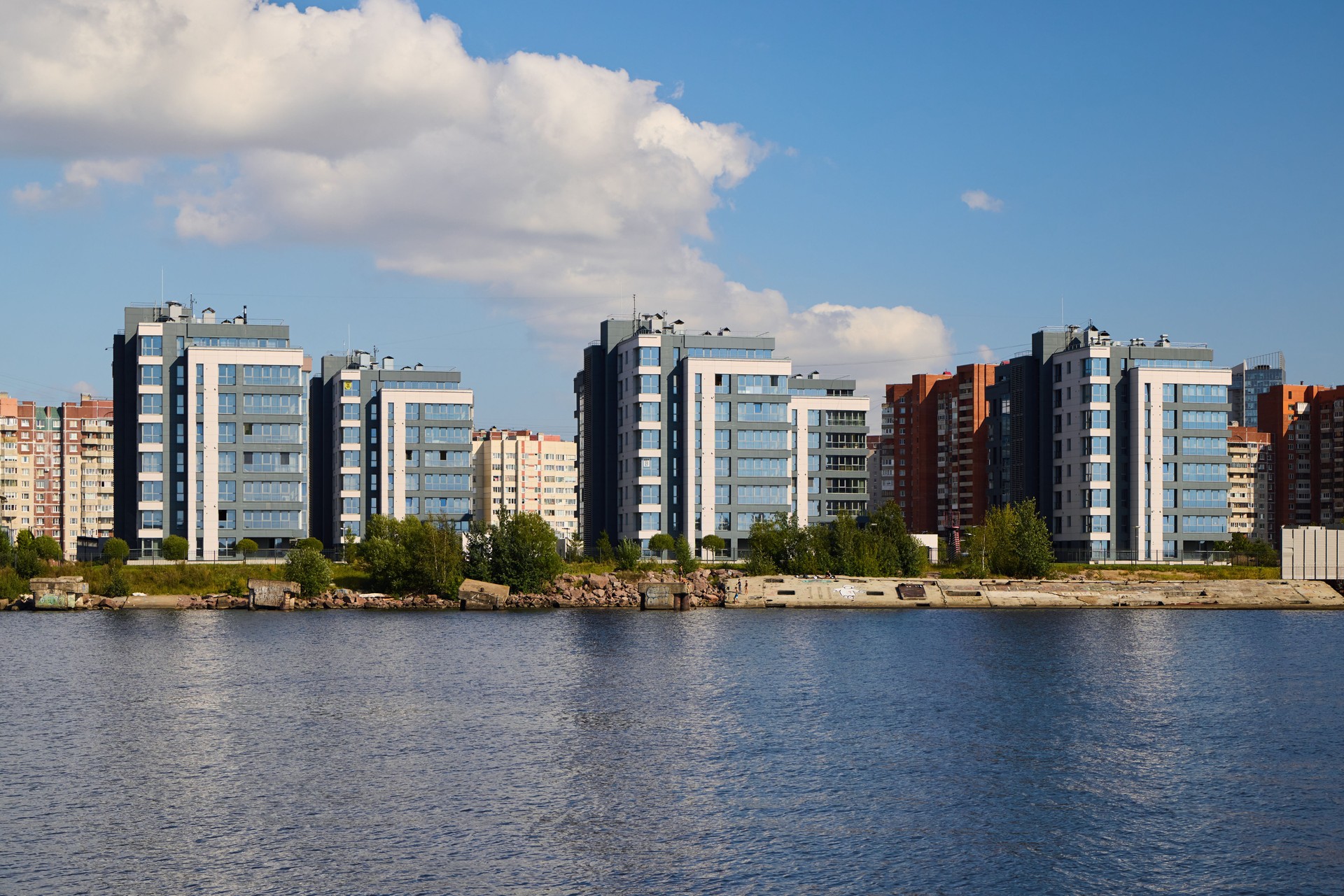 Stunning and Modern Waterfront Buildings Standing Proudly Beneath a Bright Blue Sky